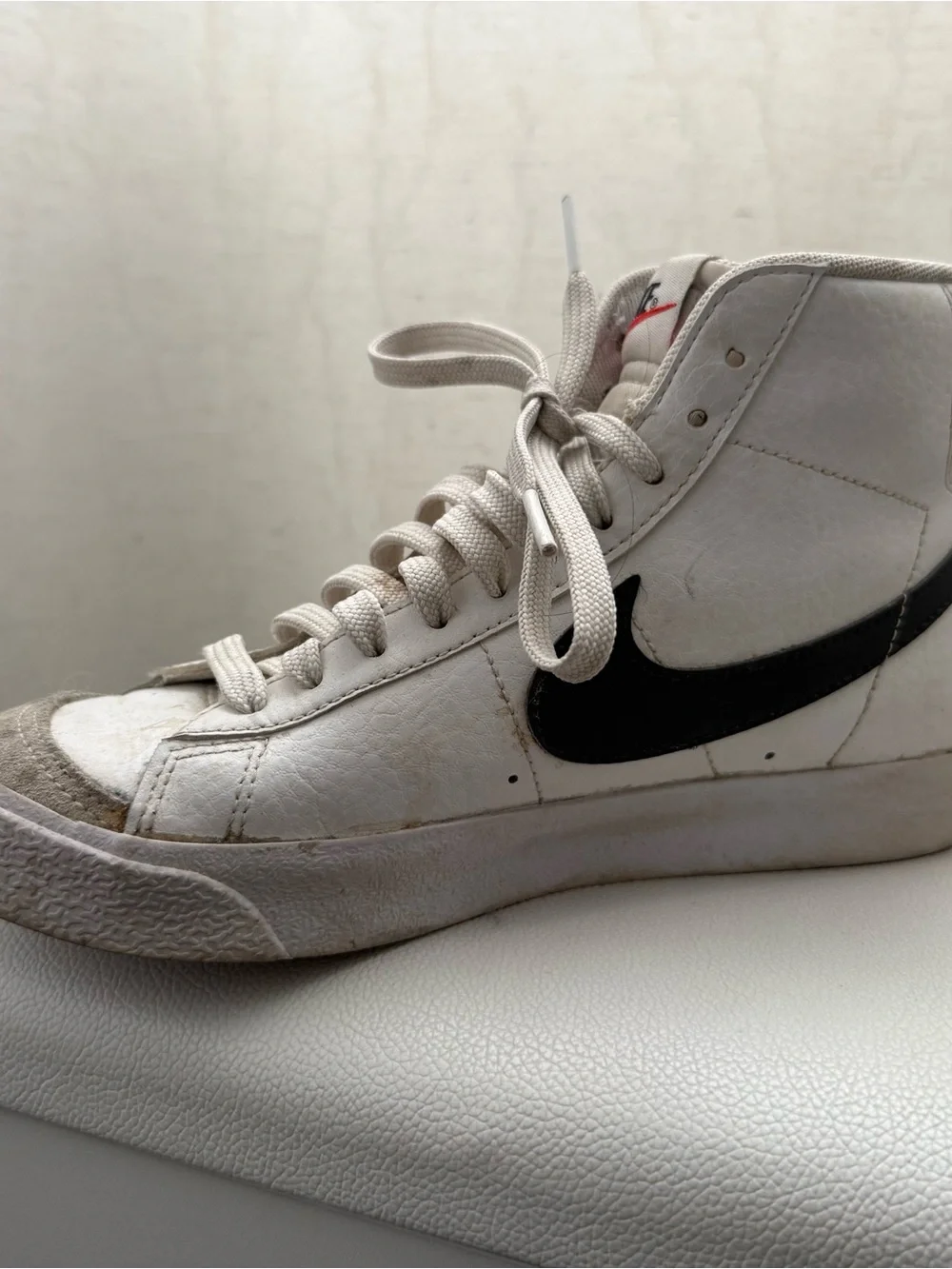 Nike Men’s White High-Top Sneakers with Black Swoosh and Red Tongue Logo